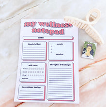 Load image into Gallery viewer, Wellness notepad-stationary with pink claw clip and Frida Kahlo enamel pin 
