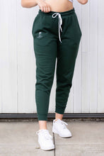 Load image into Gallery viewer, Woman wearing emerald green loungewear 
