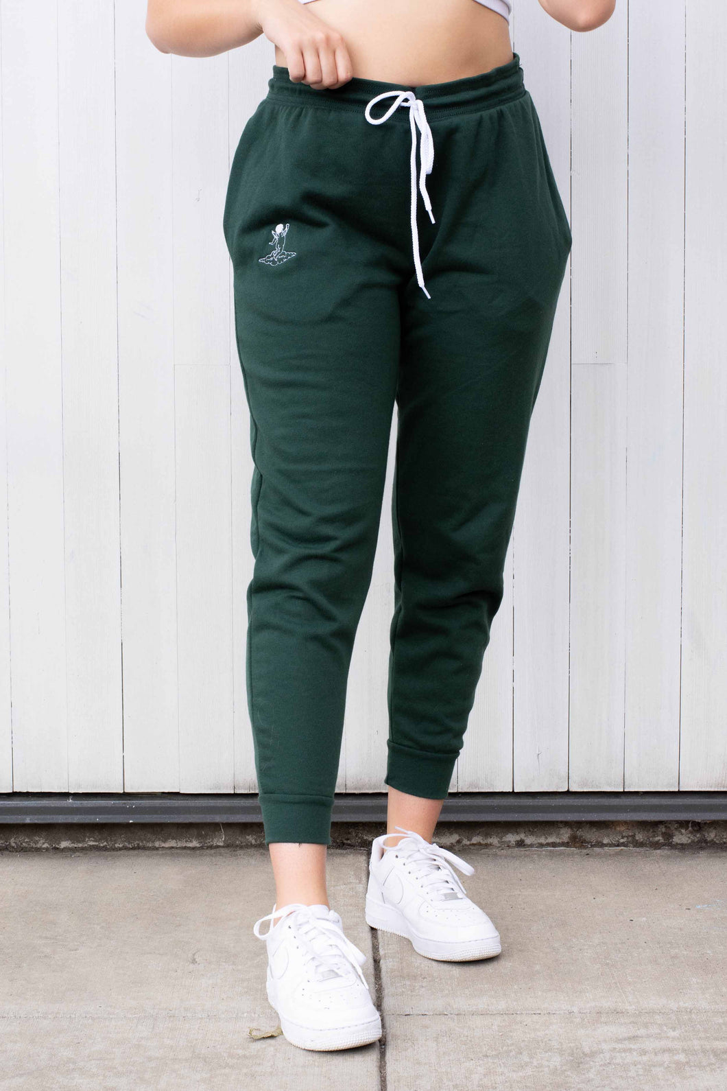 Woman wearing emerald green loungewear 