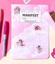 Load image into Gallery viewer, Pink Journal titled &#39;Manifest&#39; with clouds and cherubs. 
