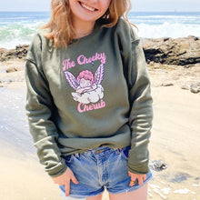 Load image into Gallery viewer, Girl wearing sweatshirt on the beach with an angel logo
